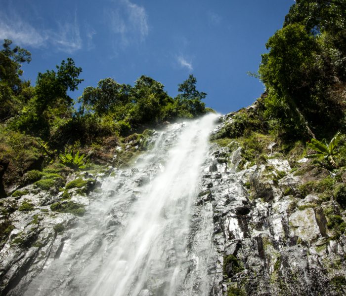 High waterfall inside florest